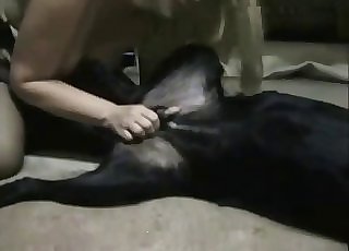 Blond-haired MILF faps a dog